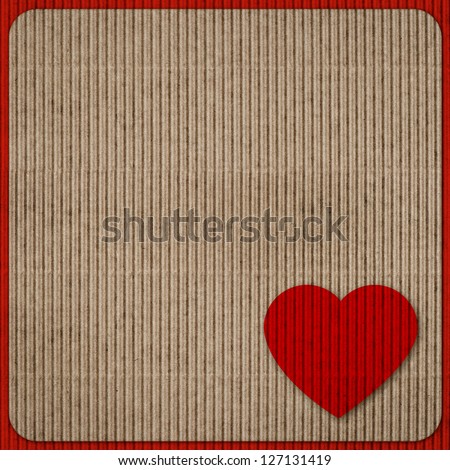 recycled nature colored cardboard paper texture with red heart. abstract background. Valentine's Day concept
