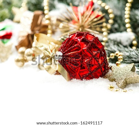 christmas composition with red baubles and golden decoration on white background