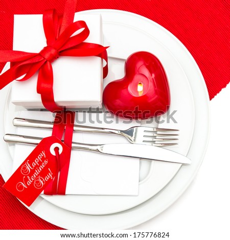 Valentines Day table place setting decoration in red and white. romantic candle light dinner. Happy Valentines Day!