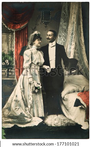 FRANCE, PARIS - CIRCA 1900: portrait of just married couple. bride and groom wearing vintage clothing. antique wedding photo. Illustrative editorial image, subject of human interest