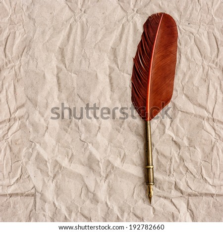 aged paper with antique ink feather pen. vintage background with space for your text