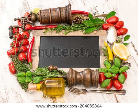 fresh vegetables, spices and herbs with blackboard. food ingredients