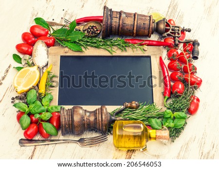 fresh vegetables, spices and herbs with blackboard. food ingredients. retro style toned picture