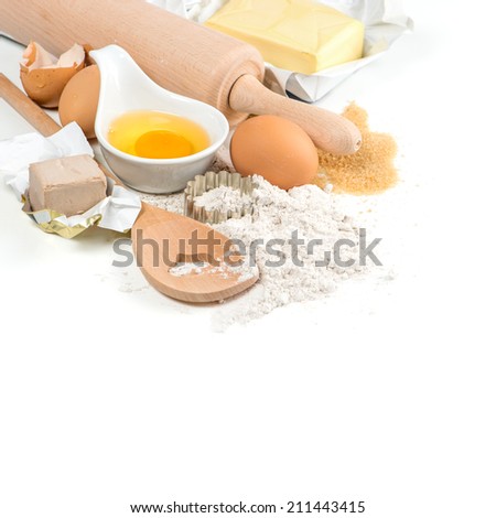 baking ingredients eggs, flour, yeast, sugar, butter. kitchen utensils. food background