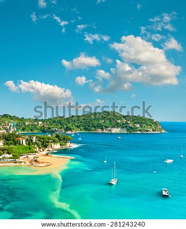 Turquoise Mediterranean sea and sloudy blue sky. Villefranche by Nice, French riviera. Summer holidays