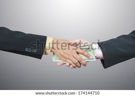 businessman hand and money to other for corruption concept