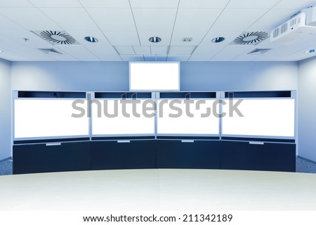 teleconferencing, video conference and telepresence business meeting room with blank screen display monitor