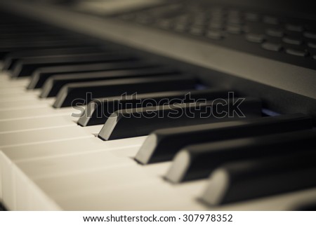 abstract background of Piano Keyboard synthesizer closeup key frontal view