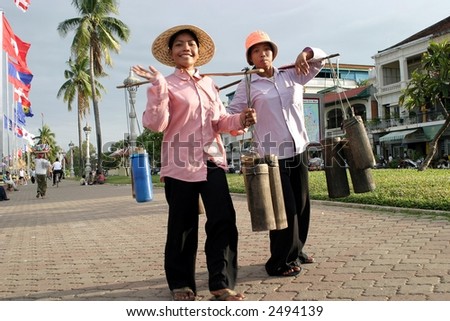 Two women selling palm wine.