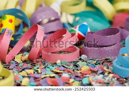 colorful party streamers on confetti