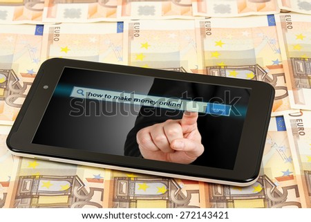 tablet computer on banknotes, making money online concept