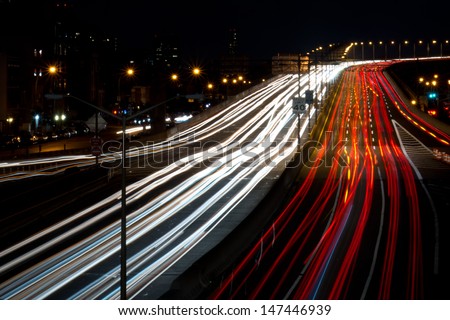 Light streaks on a busy highway in New York City.