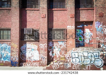 NEW YORK CITY, NEW YORK - NOV 10:  Graffiti covered brick building in Williamsburg in Brooklyn on November 10, 2014. Williamsburg is known for its hipster vibe.