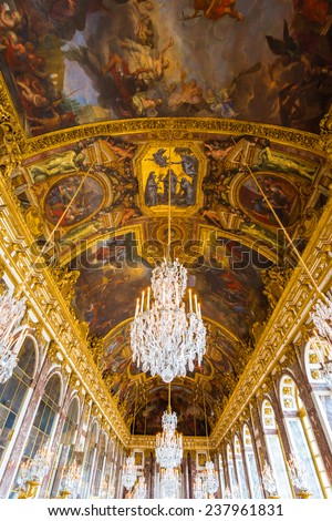 PARIS- NOV 2: The ceiling in the Hall of Mirrors in Versailles Palace outside Paris, France on November 2, 2013. The Hall of Mirrors is the palace\'s central gallery and is famous for its ornate decor.