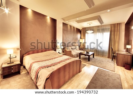 Belgrade, Serbia - March 24, 2012: The interior of a luxurious hotel room, with king bed.