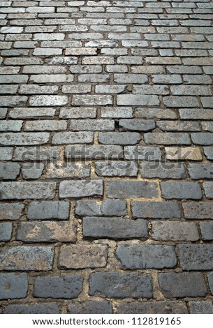 Old London cobblestone street close up.