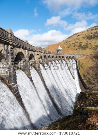 Craig Goch dam overflowing with water in the Elan Valley Wales UK.