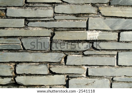 Gray slate stone wall.