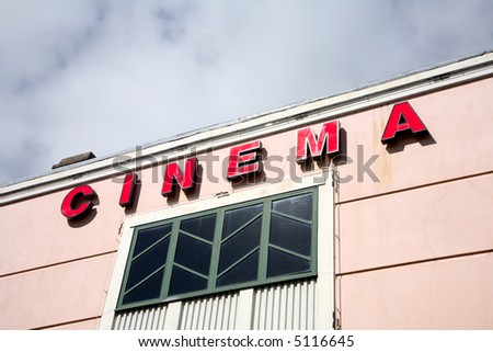 Old red British cinema sign.