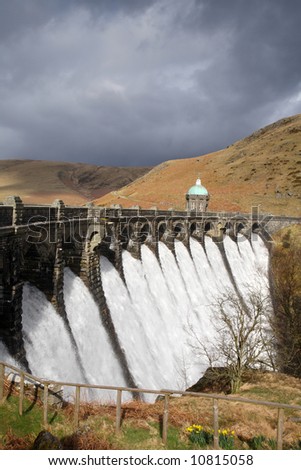 Water overflowing a dam, Craig Goch reservoir, Elan Vally Wales.