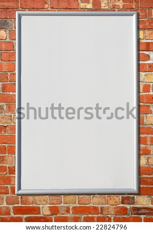 White blank billboard sign on a red brick wall.