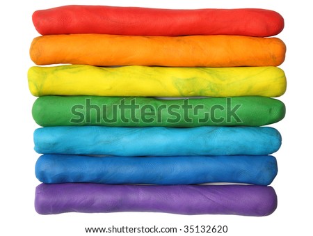 Rainbow colors plasticine play dough modeling clay isolated over white.