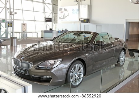 BRUSSELS-AUGUST 11: The new BMW 650i on display, for advertising and marketing reasons, on August 11, 2011 in the airport of Brussels, Belgium. A crowded airport is a good place for advertising.