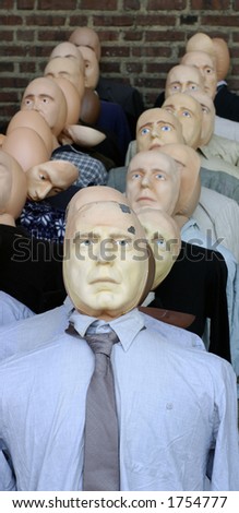 A face in the crowd. Group of dummies or dolls representing a crowd of people.