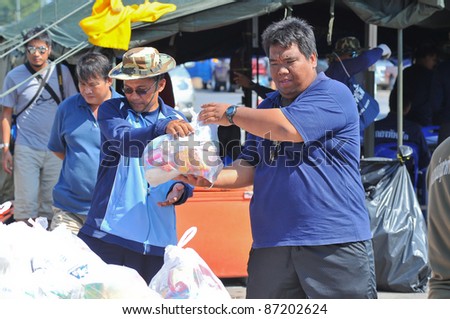 AYUTTAYA, THAILAND - OCT 22: Thai military transport food supplies to help people after the city was flooded during the monsoon season on October 22, 2011 in Bangkok, Thailand.