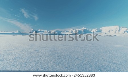 Similar – Image, Stock Photo snow covered landscape with country road, small deciduous trees on the left and higher conifers on the right of the road in sunshine / winter