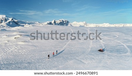 Similar – Image, Stock Photo Snowed in are paths, streams, bridges and forests. A pack of deer is looking for food and water.