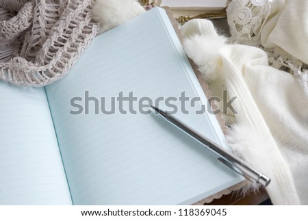 note book put on wool scarf in winter morning