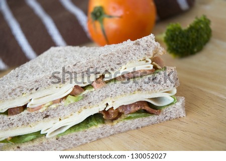 close up gaba bread with slice chicken and bacon sandwich