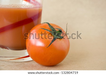 close up fresh tomato with tomato juice on brown background
