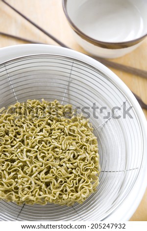 close up green noodles prepare to cook