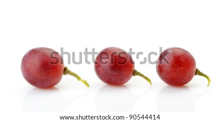 Three berries of red grapes abreast. It is isolated on a white background