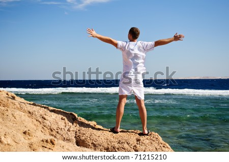 Photograph of an energetic and satisfied man on the beach in Egypt