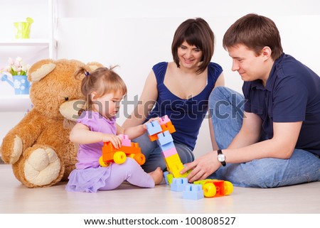 Happy family playing with blocks