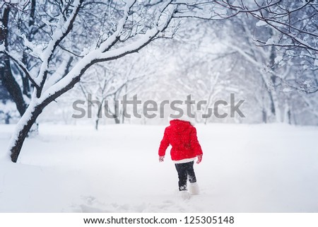 Little kid  running on snow