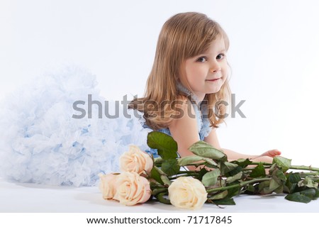 sweet little girl with Bouquet of roses