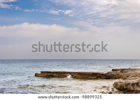 Breakwater. Picture taken in Santa Pola town. It is a coastal town located in the comarca of Baix Vinalopo, in the Valencian Community, Alicante, Spain, by the Mediterranean Sea.
