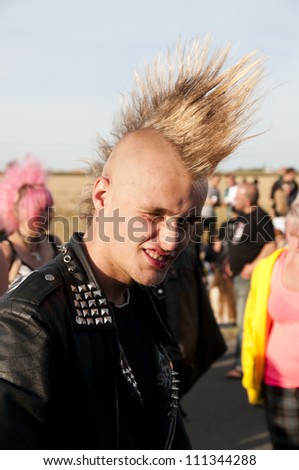JAROCIN, POLAND - JUNE 22: An unidentified fan of rock and punk music at Jarocin Festival in Poland on June 21, 2012 in Jarocin in Poland