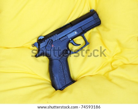 Gas gun on yelloq pillow