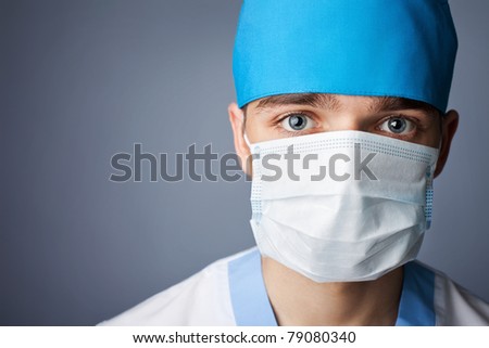 close up portrait of medical doctor in mask with copy space