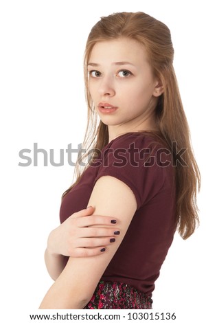 Scared beautiful girl at the age of fifteen looking at the camera on white background
