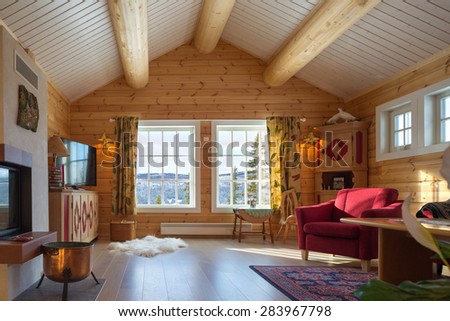 Beautiful wood log house interior background with furniture
