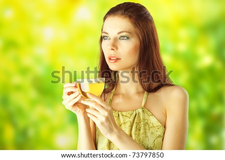 Beautiful Girl Drinking Healthy Green Tea. Healthcare or Herbal medicine concept