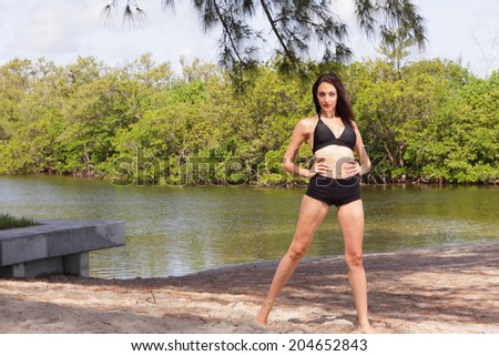 Stock photo of a bikini model with hands on hips