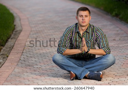 Stock image meditating man on a pathway