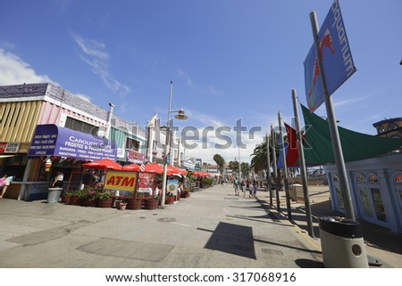SANTA MONICA - AUGUST 6: Image of the Santa Monica Pier which was built in 1909 and is located at the end of Colorado Street on the Pacific Ocean August 6, 2015 in Santa Monica CA, USA